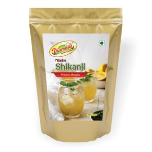 "A refreshing glass of Shikanji, traditional Indian lemonade garnished with mint leaves and lemon slices."